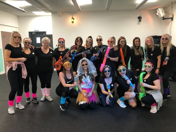 Group enjoying 80s dance hen party with Madonna and Flashdance moves